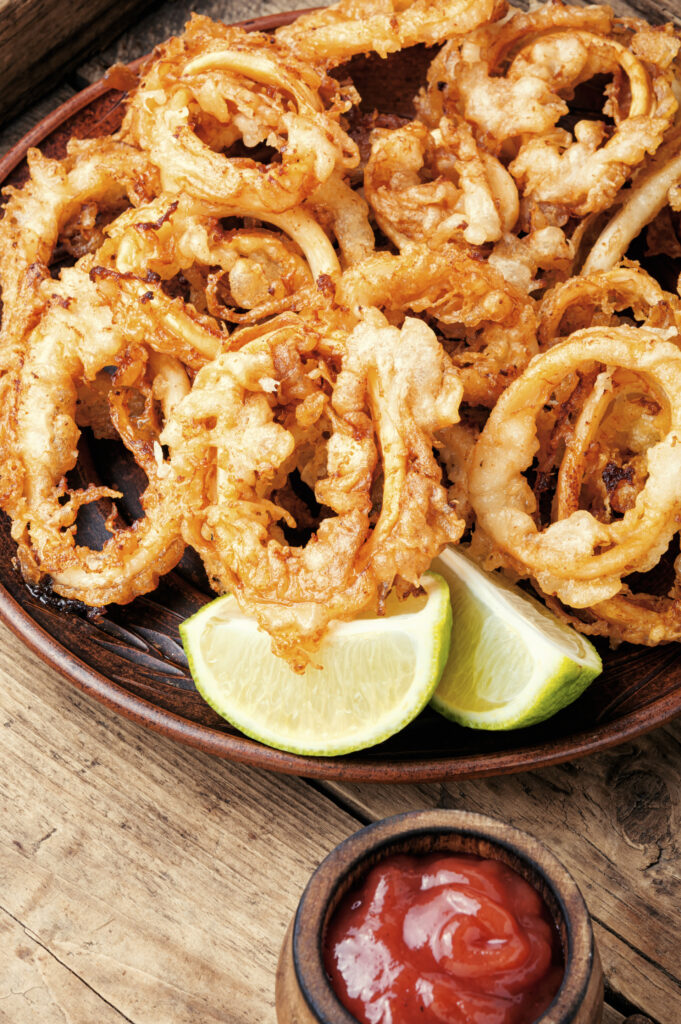 Fried squid or calamari rings with sauce